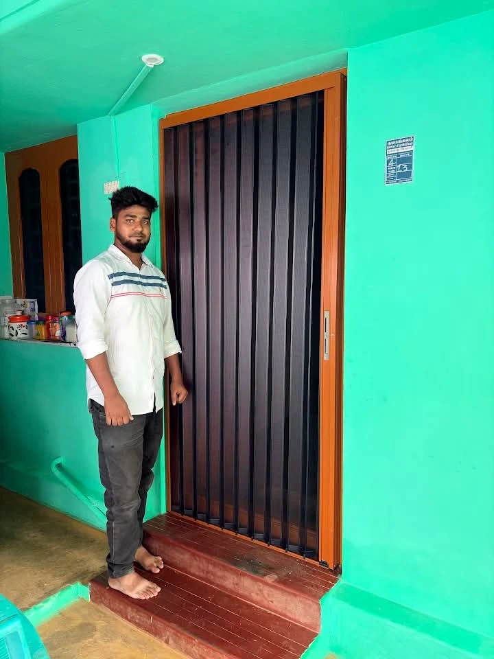 Pleated mosquito mesh door installed at residence